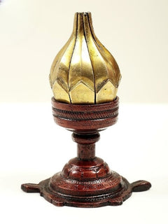 Gold brass vessel top with ridged design on dark wooden candle stand, 3 in