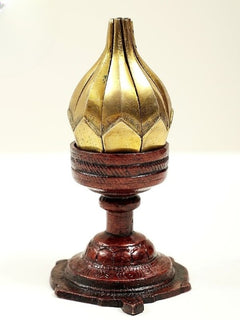 Brass lotus candle with ribbed gold top and ornate dark base
