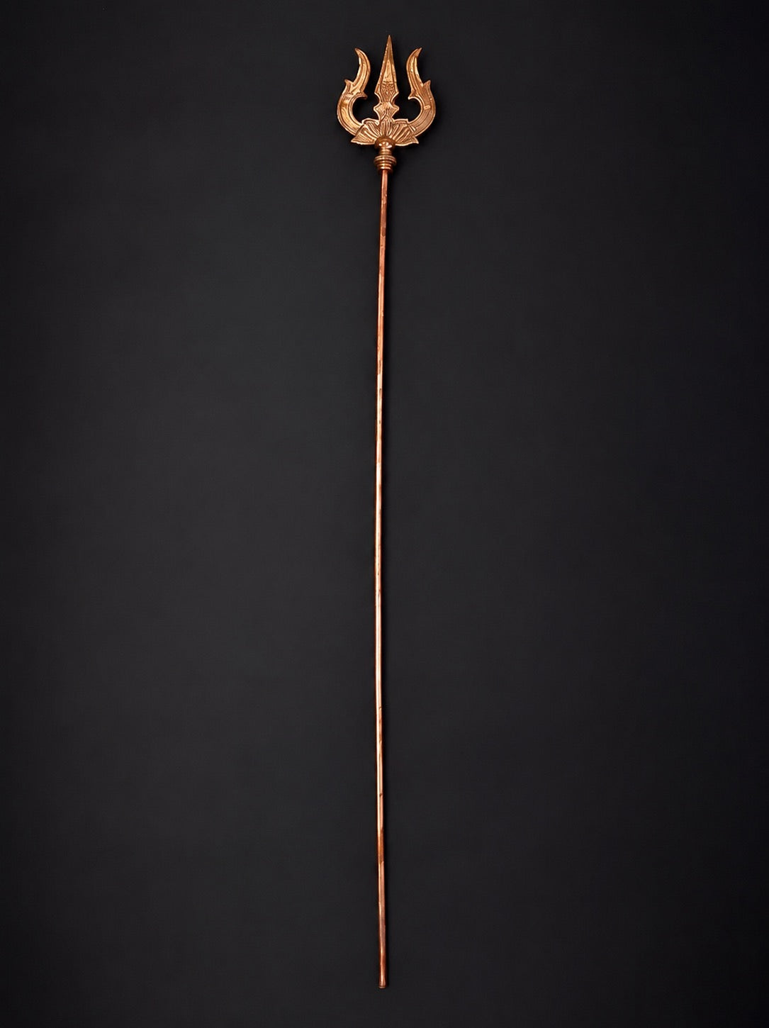Large copper trishul staff with three-pronged tip and long shaft