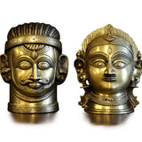 Brass Shiva and Gauri head sculptures, mirrored side view, two-tone gold and silver