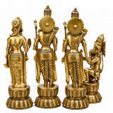Set of four golden brass deity statues standing and seated on round carved bases