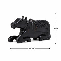 Dark Nandi bull figurine, side profile, detailed saddle with diamond texture