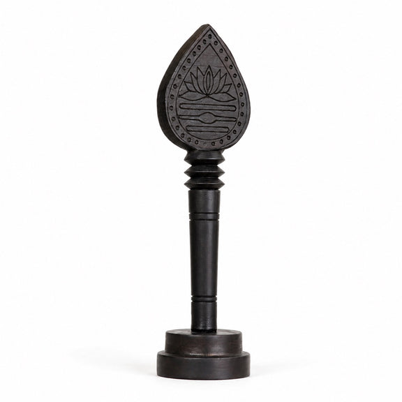 Dark wooden vel with engraved lotus teardrop head and round display base