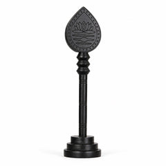 Dark wooden vel with engraved lotus teardrop head and round base stand