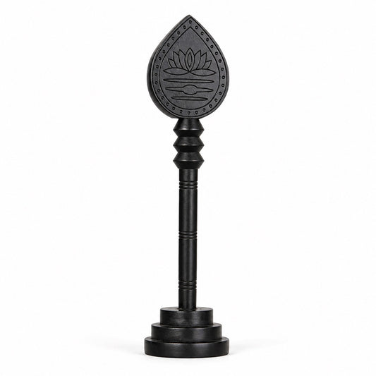 Dark wooden vel with engraved lotus teardrop head and round base stand