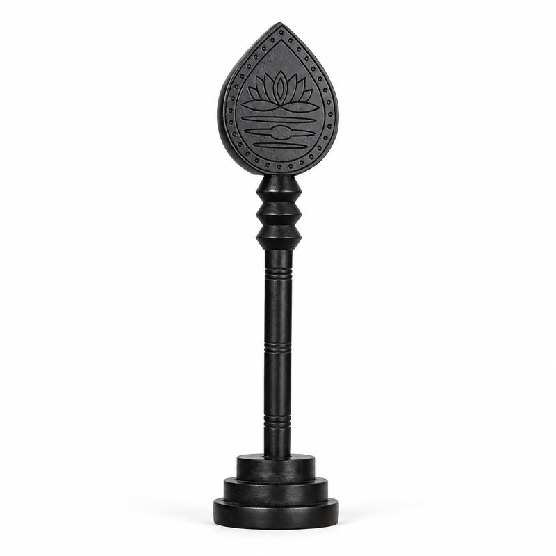 Dark wooden vel with engraved lotus teardrop head and round base stand