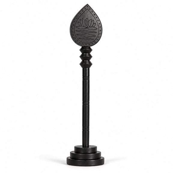 Dark wooden vel stick with engraved lotus teardrop head and circular base