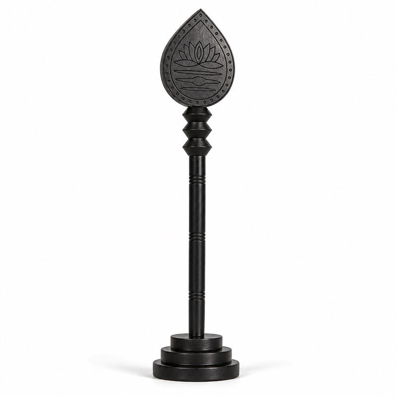 Dark wooden vel stick with engraved lotus teardrop head and circular base