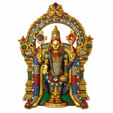 Brass-tone wall hanging with front-facing deity figure in ornate arched frame