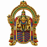 Brass-tone wall hanging with seated deity figure, jeweled halo arch and ornaments