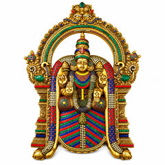 Brass-tone wall hanging with seated deity figure, jeweled halo arch and ornaments