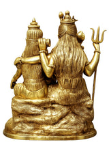 Brass Parivar idol from side view, seated couple with trident and child on round base