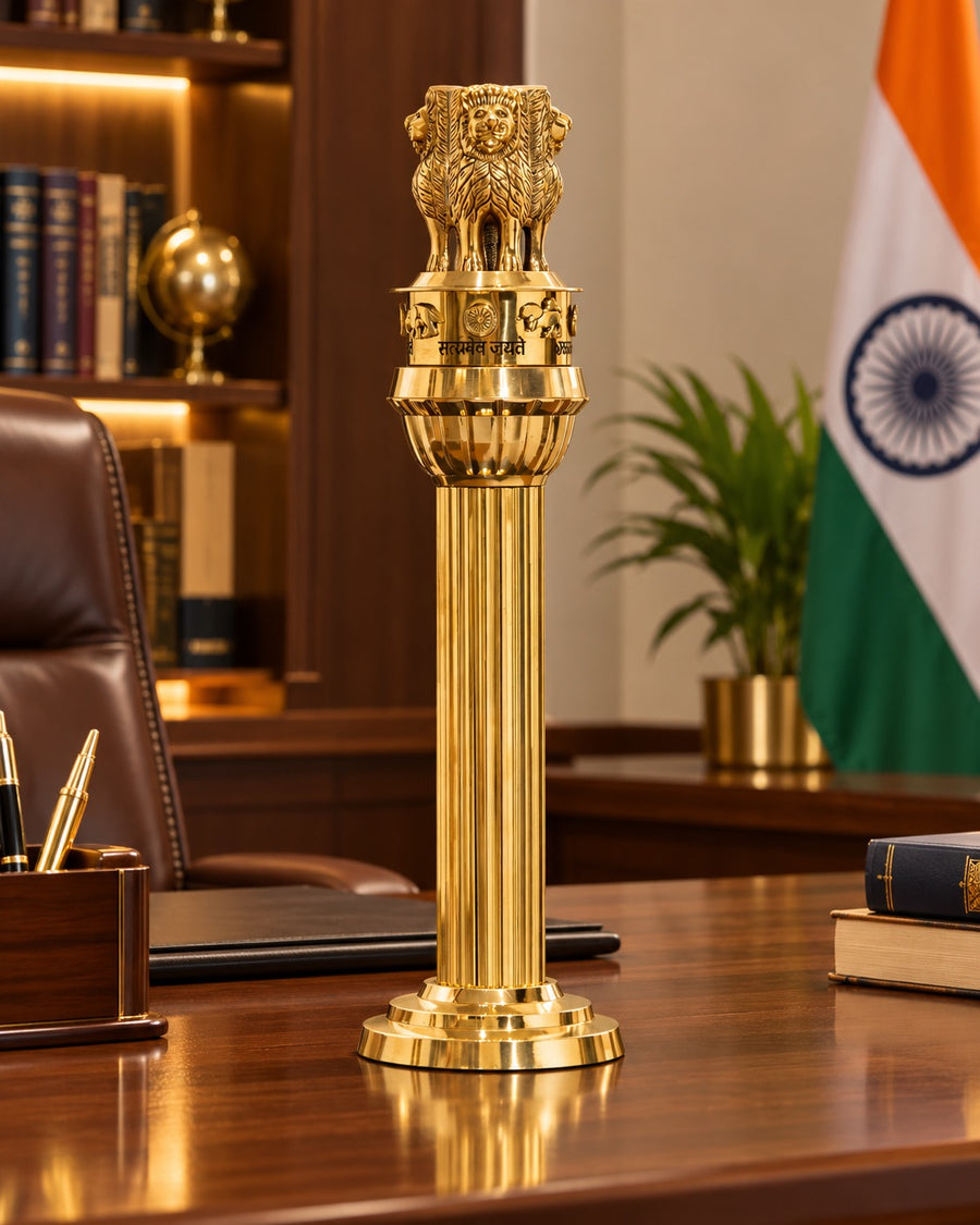 Brass Ashoka Pillar showpiece displayed on a desk, with lion capital and fluted column
