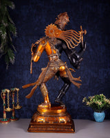 Ardhanarishvara statue rear/side view, trident held aloft, richly detailed patterned back
