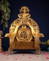 Brass ram darbar idol back plate with carved circular emblem and decorative feet