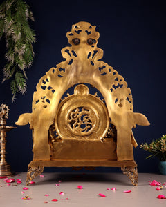 Brass ram darbar idol back plate with carved circular emblem and decorative feet