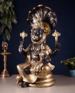 Brass Narsimha Lakshmi statue with detailed face, halo, and crossed seated legs