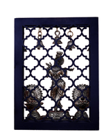 Brass Lord Krishna idol and hanging bells set, framed with lattice cutout back