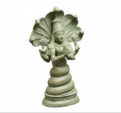 Antique green Patanjali brass statue, side view with ornate standing arch