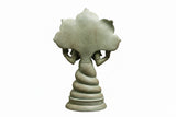 Antique green Patanjali brass statue, rear view with textured halo-like arch