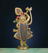 Brass Shreenathji murti with multicolour stonework, one arm raised, flute-holding pose