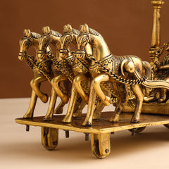 Brass chariot sculpture horse detail with engraved harness, chains, and patterned wagon base