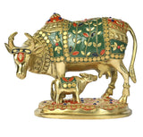 Brass cow and calf figurine, green enamel inlay with leaf and dot patterns