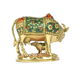 Brass cow and calf figurine, green inlay panels with red floral accents