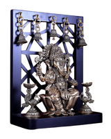 Brass Ganesha idol with raised hands, detailed jewelry, flanked by two oil lamps