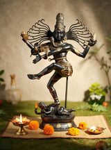 Dancing Shiva Nataraja brass sculpture, many-armed halo, one leg lifted