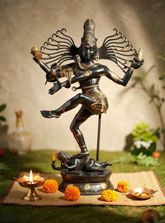 Dancing Shiva Nataraja brass sculpture, many-armed halo, one leg lifted