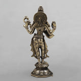 Brass Saraswati standing sculpture, back view with circular halo disc and carved jewelry