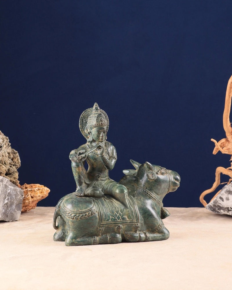Indonesian Bronze Lord Krishna Sitting on Cow Idol (Height: 9 inch)