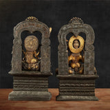 Back view of antique brass Chola Lakshmi and Ganesh idols with arched halo