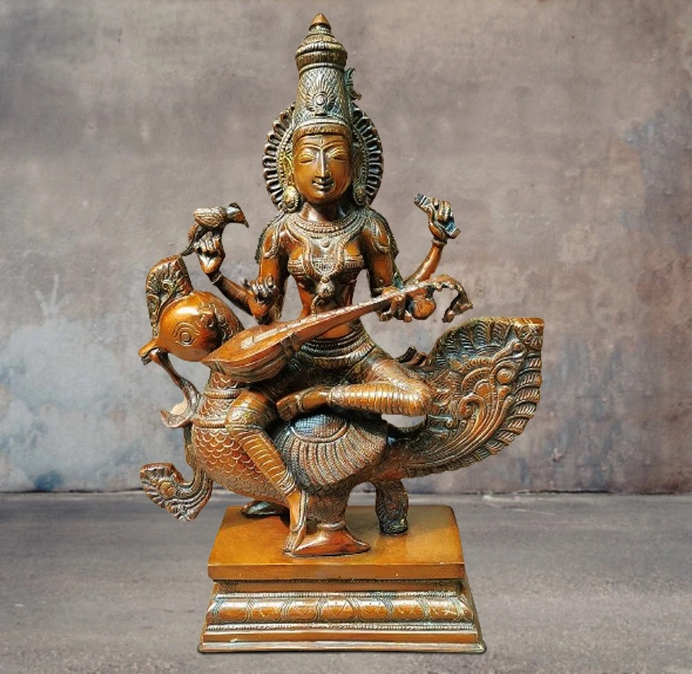 Brass Saraswati Maa Chola statue seated on a fish, holding a veena, detailed base