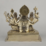 Back view brass Ganesh idol with Riddhi and Siddhi, ornate headdress and arms