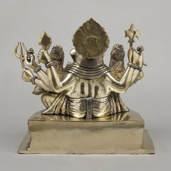 Back view brass Ganesh idol with Riddhi and Siddhi, ornate headdress and arms