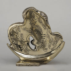 Brass Shiva Parvati moon idol, back view with engraved hair texture on crescent base