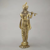 Brass Krishna flute sculpture, back view with flowing robe folds and detailed turban