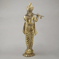 Brass Krishna flute sculpture, back view with flowing robe folds and detailed turban