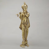Brass Krishna flute figure, turbaned head and carved drapery, full-body view
