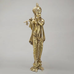 Brass Krishna flute figure, turbaned head and carved drapery, full-body view
