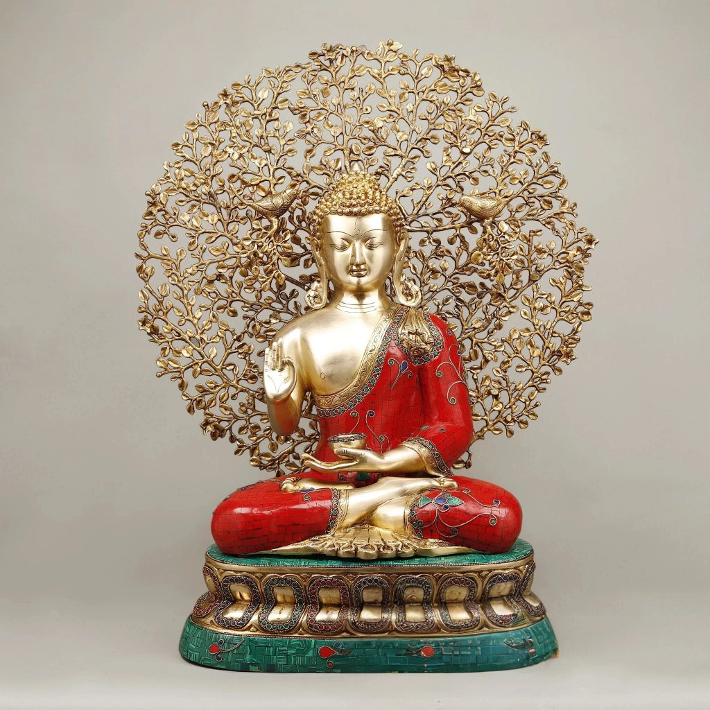 Seated Buddha statue with tree canopy, red robe, green base, gold-tone accents