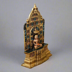 12-inch brass Mahavir Swami idol, angled view of carved arch and seated figure