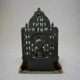 Dark brass Mahavir Swami idol back view, spiked arch frame over seated figure