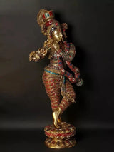 Krishna playing flute statue in gold-tone brass, red patterned clothing with gems