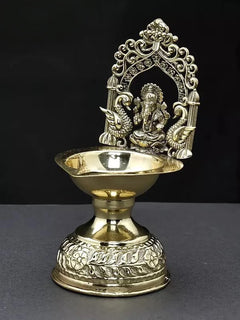 Brass diya with Lord Ganesha in ornate arch, round dish and detailed base