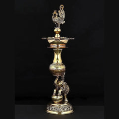 Brass peacock lamp with wide top dish and engraved pedestal, 14 in height