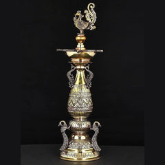 Gold-tone brass peacock lamp with detailed patterns, urn-style bowl, 16-inch height