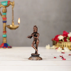 Copper Krishna deity statue, 4.5 in tall, standing in dancing pose on base
